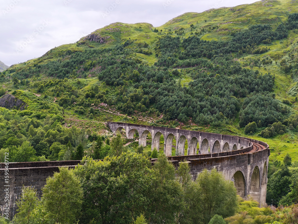Fototapeta premium Railway road in the mountains of Scotland. Beautiful landscape