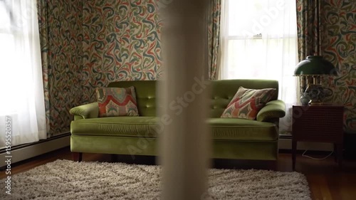 Vintage Green Sofa with Retro Wallpaper in Cozy Living Room