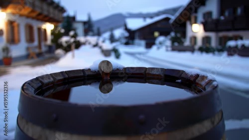 Wooden barrel in winter village scene