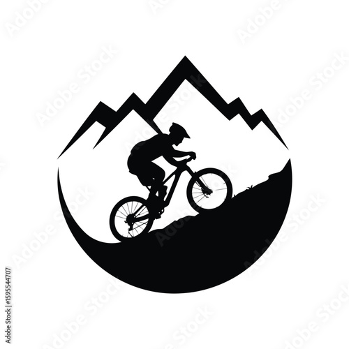 Mountain biker silhouette riding downhill with mountains and moon