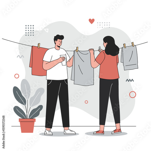 Young couple hanging laundry while chatting at home with plant  