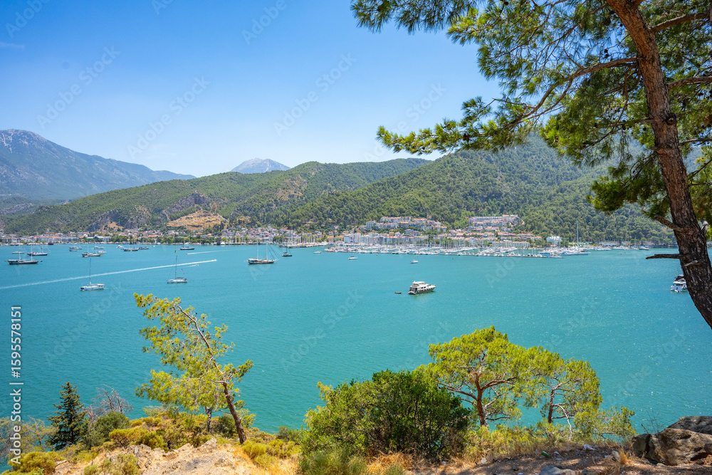 Obraz premium Boncuk Bay, Blue Lagoon and Oludeniz beach aerial panoramic view. Oludeniz is a beach resort in the Fethiye district of Mugla Province, Turkey.