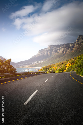 Scenic Coastal Road through Cape Town Suburbs with Mountains and Ocean View