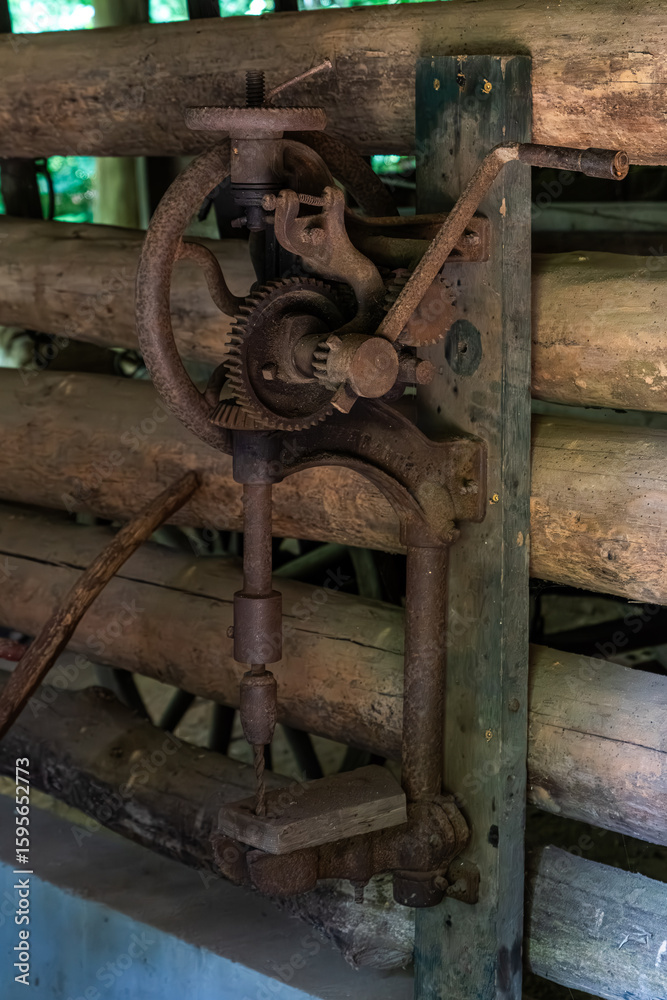 An old hand-operated drill press An old hand-operated drill press