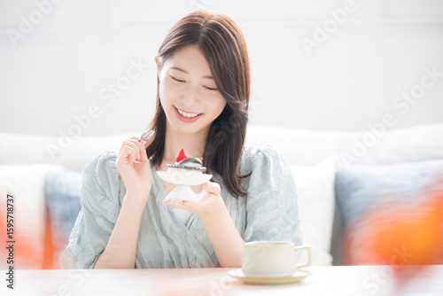 Bilde på lerret Autumn of appetite Woman eating sweet sweets with a smile Sweets are eaten separ