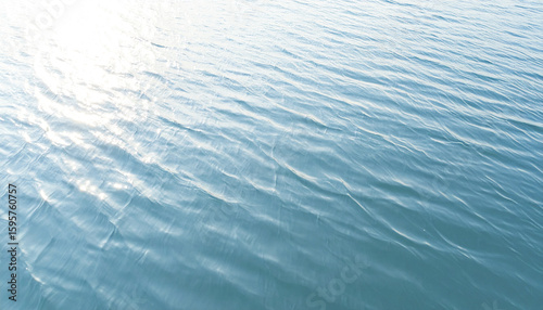 Peaceful body of water with subtle motion and gentle ripples reflecting soft sunlight, creating calm and serene natural surface perfect for relaxation and outdoor scenery