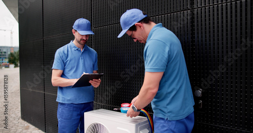 Hispanic HVAC Repair Technician Servicing HVAC System