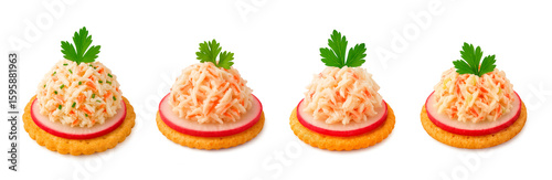 Mini crab canapes with shredded crab salad on radish slice and cracker, topped with parsley leaf, isolated set on white background for seafood snack or catering ideas