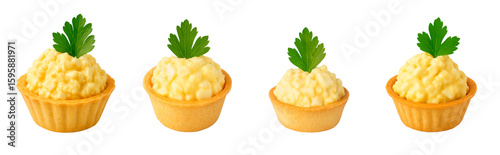 Mini egg salad tartlets with creamy chopped egg mixture and parsley garnish isolated on white background; egg salad set offers clean snack concept and catering idea