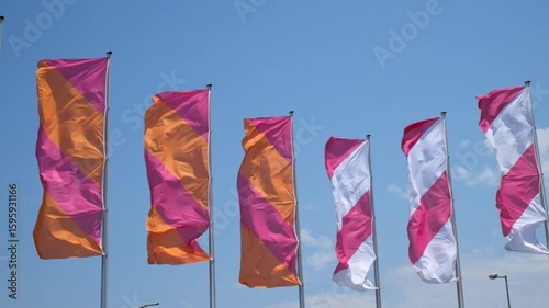 flags waving in the wind against cloudy sky