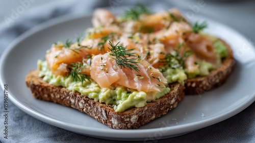 Creamy avocado toast with smoked salmon and dill sprigs, minimalist Scandinavian design avocado toast, smoked salmon, dill, Nordic style, Scandinavian kitchen, healthy fats, omega-
