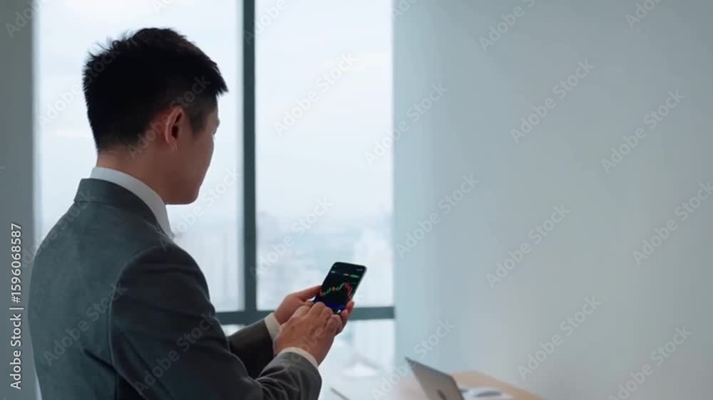 Office workers, business people, white-collar professionals, checking their phones for updates on the financial markets. Office workers, business people, white-collar professionals, checking their phones for updates on the financial markets.