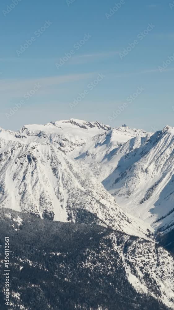 Blue stripes against winter landscape with snowy mountain ranges and blue sky Blue stripes against winter landscape with snowy mountain ranges and blue sky