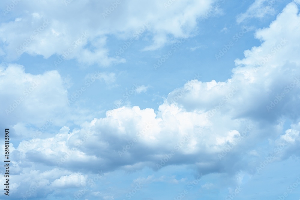 Fototapeta premium Bright blue sky with fluffy white cumulus clouds A daytime sky scene white clouds
