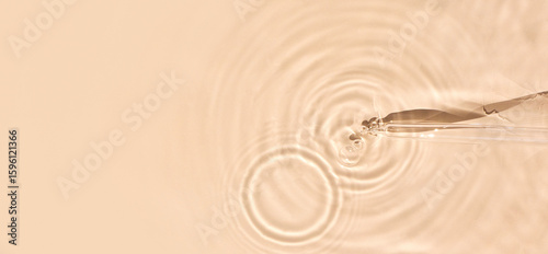 Картината върху платно pipette serum in water on beige background ripples water drops natural sunlight