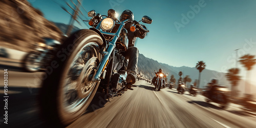 Modern bikers ride together on a scenic highway under the sun