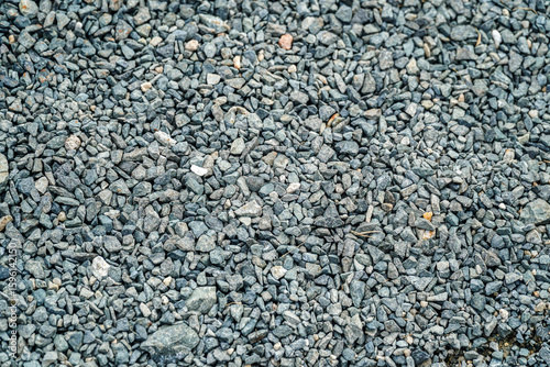 An overhead view captures a dense collection of stones, creating a naturally textured surface. The variations in tones add depth and visual interest. Ideal for backgrounds and overlays.