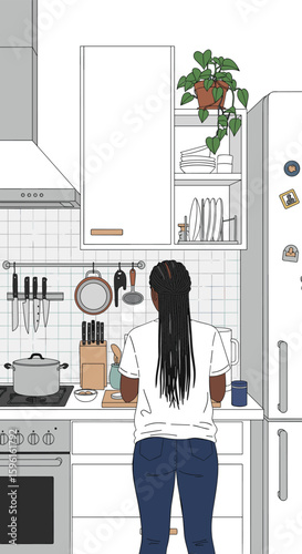 A person preparing food in a modern kitchen with white cabinets and stainless steel appliances