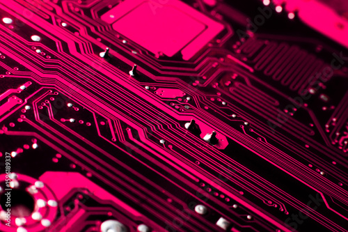 Processor on motherboard. Technological background. Digital board in neon light. Printed circuit board background. Computer board. Wallpaper with computer spare part