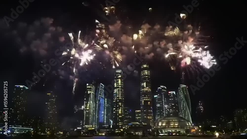 Wallpaper Mural Spectacular fireworks illuminate a city skyline at night, celebrating an event with vibrant colors Torontodigital.ca