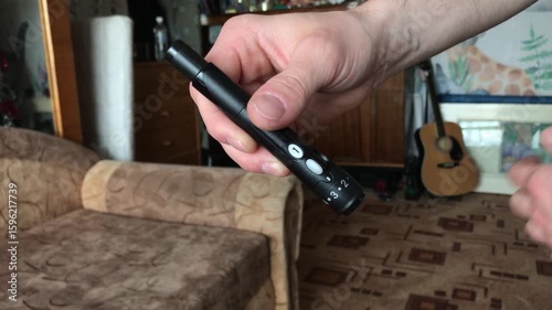 Wallpaper Mural Demonstrating a handheld device in a cozy living room Torontodigital.ca