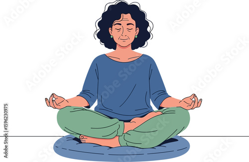 Woman with curly hair meditating in lotus position on a blue cushion.