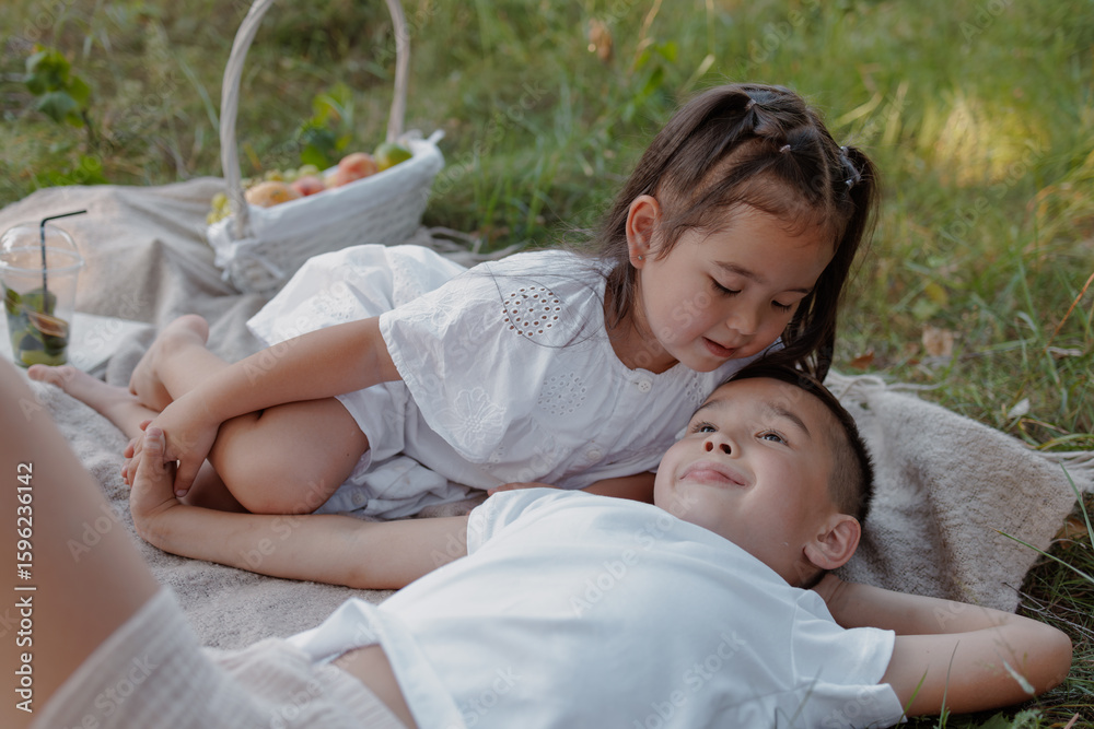 Happy Children Enjoying Summer Picnic Outdoors, Sibling Bonding and Family Leisure in Nature Happy Children Enjoying Summer Picnic Outdoors, Sibling Bonding and Family Leisure in Nature