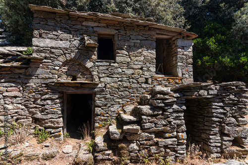 Photos Old abandoned stone house ruin at the remote mountain village of Langada on the Greek Island of Ikaria