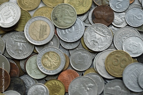 Big pile of different coins from various currencies and different countries around the world. Currency exchange