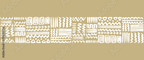 Hand drawn tribal geometric pattern with white symbols on a brownish earth tone background. This ethnic style design features abstract lines, zigzags, triangles, and dots. 