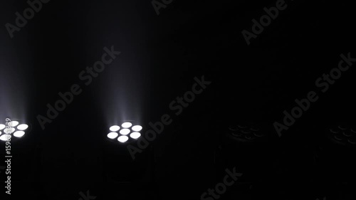 Professional lights for audio-visual shows, white colour, switching on and off. Concept: Audiovisuals, shows, technology, show.