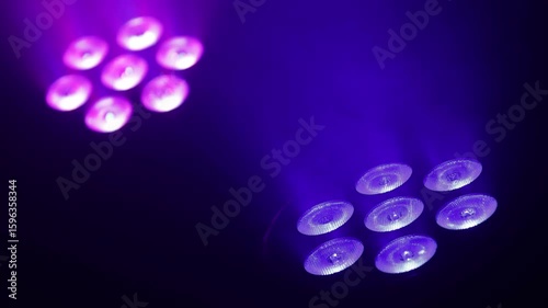 Professional lights for audiovisual shows in blue and pink. Concept: Audiovisuals, shows, technology, show.