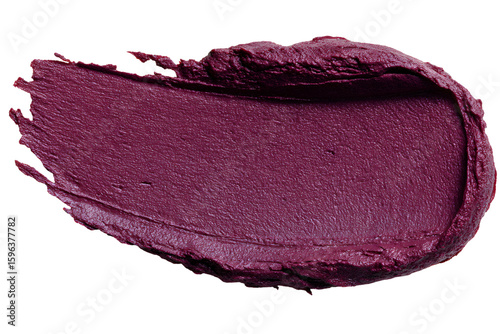 Rich plum lipstick smear on black backdrop creating an eye-catching contrast