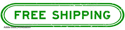 Grunge green free shipping word rubber seal stamp on white background