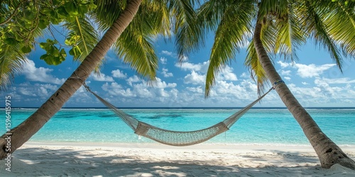 Fototapeta Naklejka Na Ścianę i Meble -  Hammock between two palms on a private beach in the Maldives