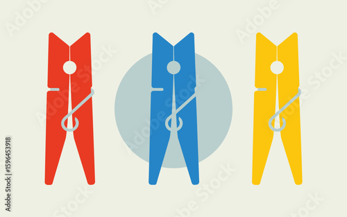Three colorful wooden clothespins in a row on a light background