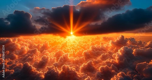 Dramatic Sunset Above Cloudscape with Fiery Orange and Golden Hues and a Bright Beam of Sunlight