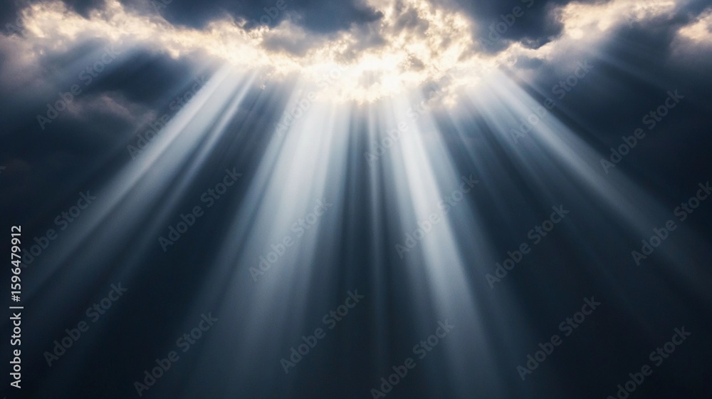Rays of sunlight pierce through dark clouds during a dramatic afternoon sky symbolizing the power of clear focus and direction amidst obstacles Rays of sunlight pierce through dark clouds during a dramatic afternoon sky symbolizing the power of clear focus and direction amidst obstacles