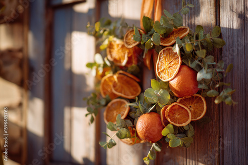 close-up of vibrant orange and eucalyptus wreath on rustic wooden door, dried citrus fall decoration in soft afternoon light, seasonal natural decor for autumn lifestyle, eco-friendly holiday vibe