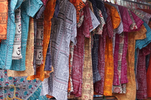 Wallpaper Mural Several garments are hanging with the hanger in a garment store Torontodigital.ca