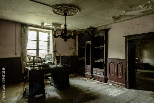 Bilde på lerret Abandoned vintage office room with old wooden furniture, peeling ceiling, and du