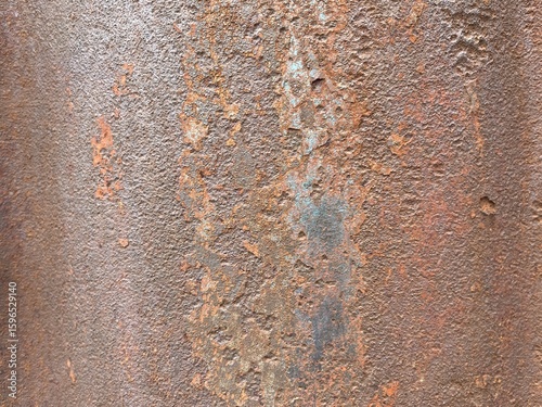 Fotografi A close-up of severely rusted and corroded metal, displaying a rich texture of pitted surfaces, flaking material, and varied shades of orange, brown, and hints of blue