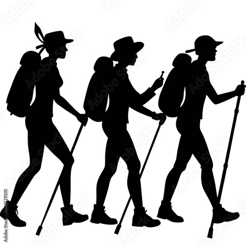 Three hikers with backpacks and trekking poles walking together
