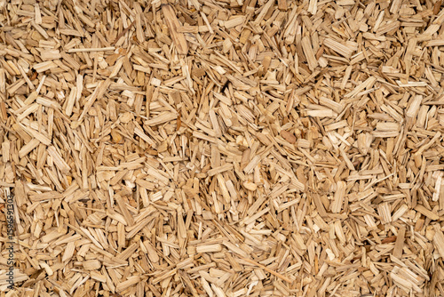 Wooden chips texture background close up. small wood chips for smoking top view. sawdust texture. ecological fuel