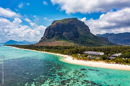 Aerial view of Le morne Brabant in Mauriutius. Tropical crystal ocean with Le Morne mountain and luxury beach in Mauritius. Le Morne beach with palm trees, white sand and luxury resorts, Mauritius.