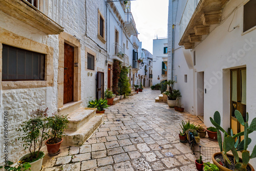 Fototapeta Naklejka Na Ścianę i Meble -  Scenic sight in Locorotondo, Bari Province, Apulia (Puglia), Italy. Characteristic streets in the Locorotondo in Puglia, Italy. Locorotondo is a town of the Metropolitan City of Bari, Apulia, Italy.