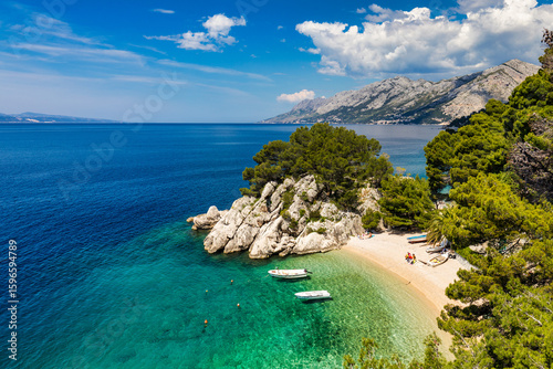 Fototapeta Naklejka Na Ścianę i Meble -  Amazing aerial view of the beautiful Podrace beach in Brela, Makarska Riviera, Croatia. Aerial view of Podrace beach and waterfront on Makarska riviera, Brela, Dalmatia region of Croatia.