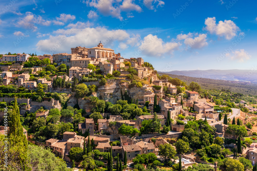 Fototapeta premium View on Gordes, a small typical town in Provence, France. Discover the stunning hilltop village of Gordes in Provence. Ancient hilltop village of Gordes, Provence, France.