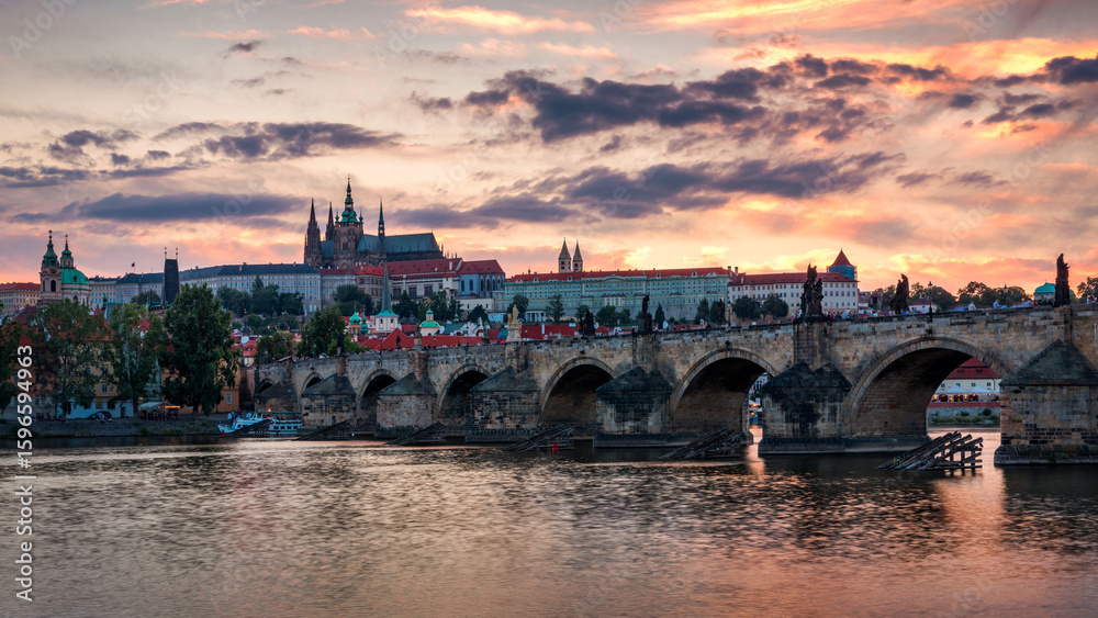 Obraz premium Charles Bridge in Prague in Czechia. Prague, Czech Republic. Charles Bridge (Karluv Most) and Old Town Tower. Vltava River and Charles Bridge. Concept of world travel, sightseeing and tourism.