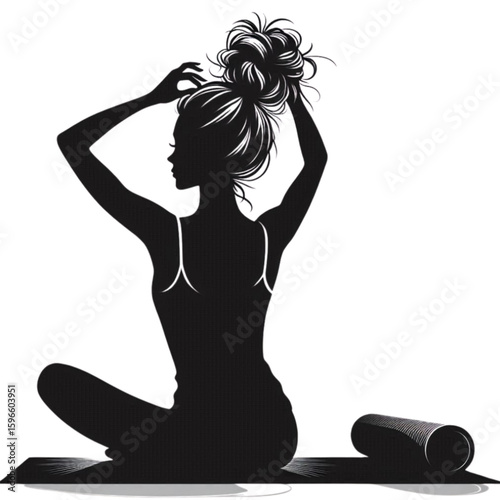Silhouette of a woman adjusting her hair while sitting on a yoga mat in a relaxed pose